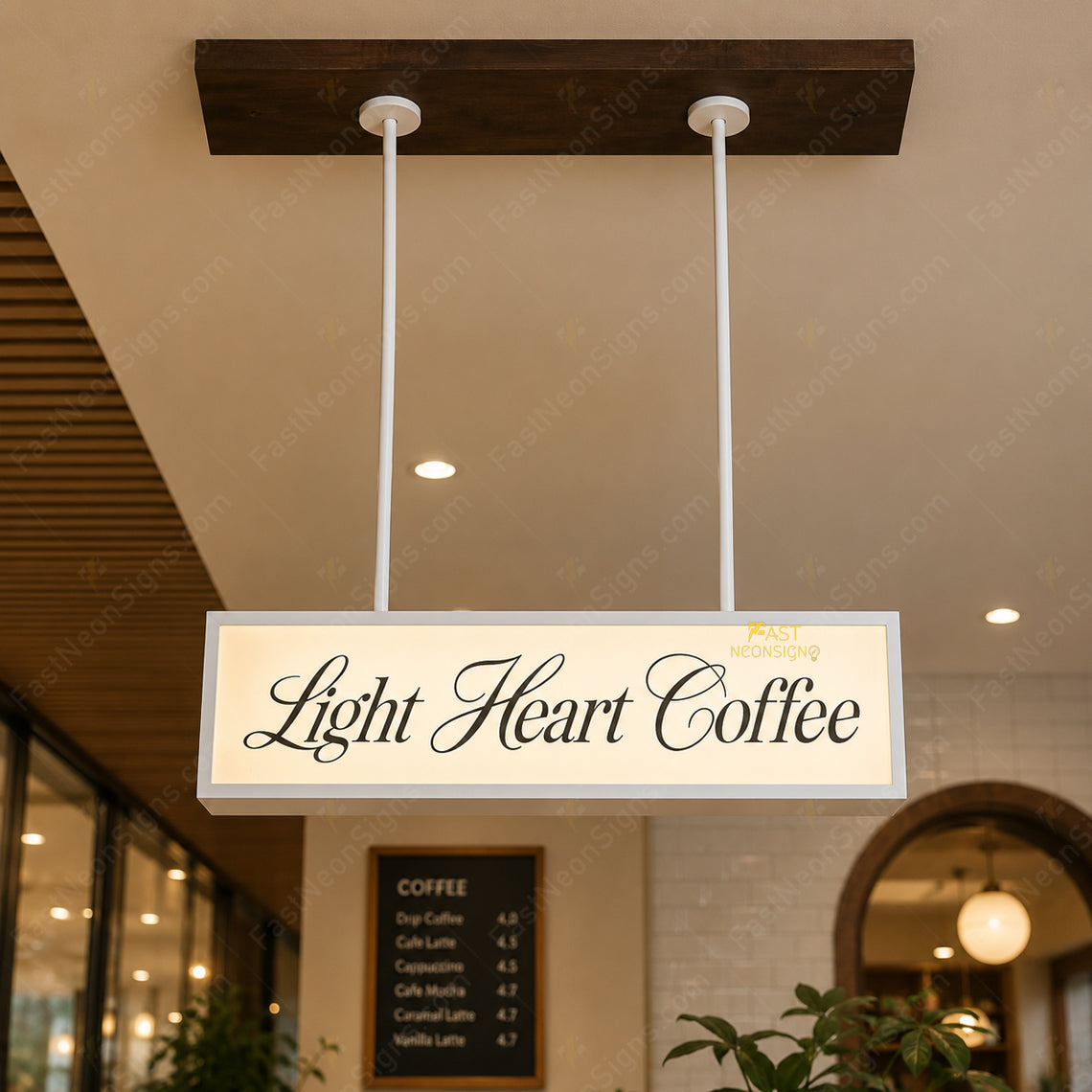 Custom hanging acrylic light box with metal frame installed above a bubble tea shop pickup counter with cold white LED lighting.