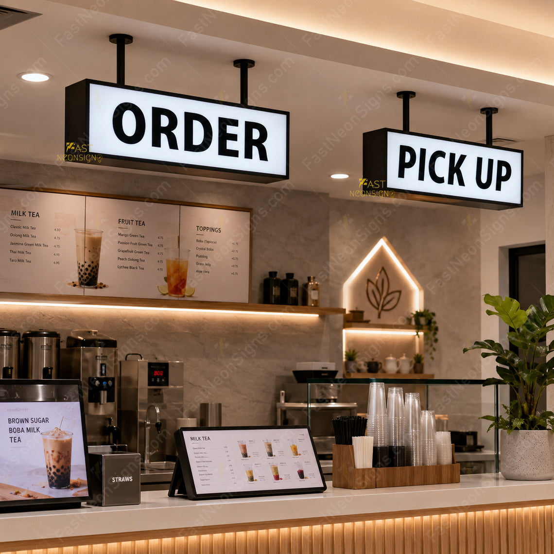 Custom hanging acrylic light box with metal frame installed above a bubble tea shop pickup counter with cold white LED lighting.