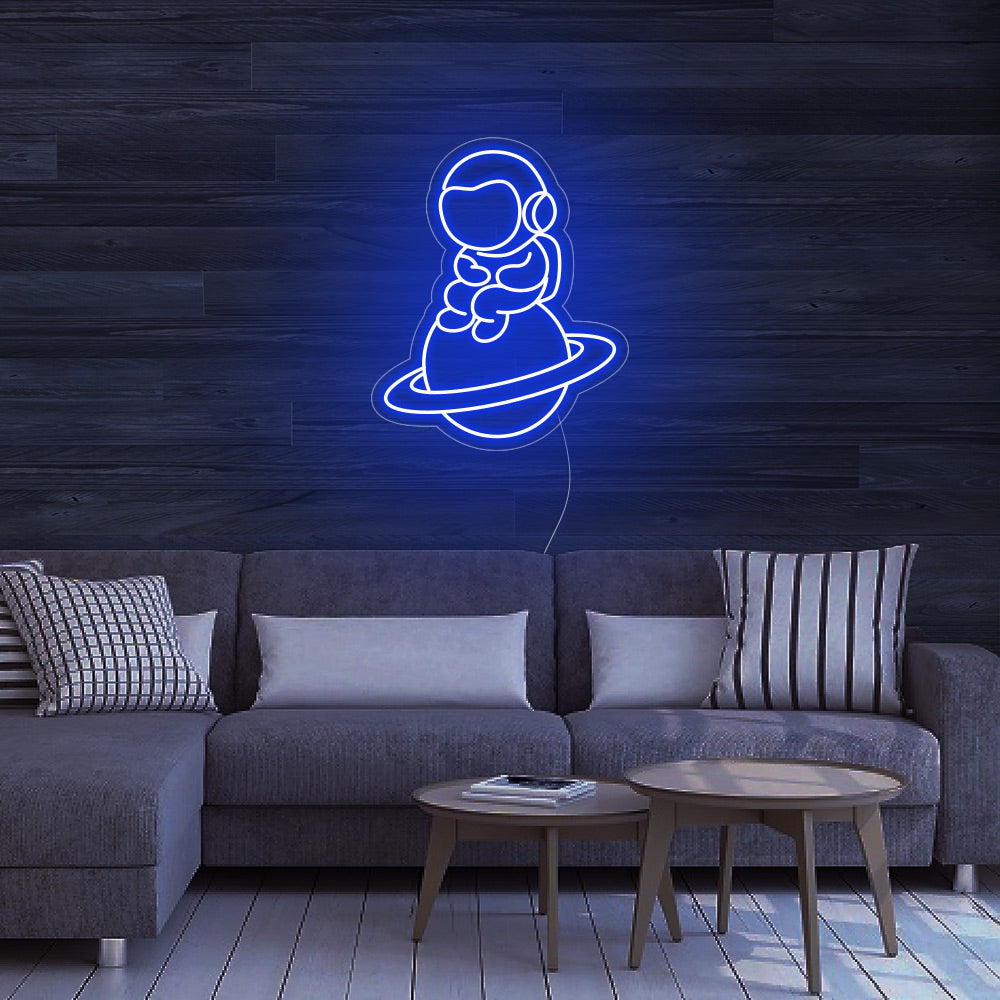 Astronaut Sitting on Planet Neon Signs